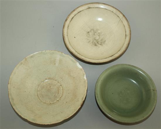 A Ding ware dish, a Yingqing bowl and a Longquan celadon dish, 12th - 15th century, 14cm